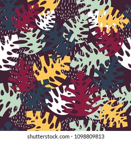 Seamless pattern with tropical leaves in dark colors. Great for textile design, wrapping paper, backgrounds and wallpapers. Cool moredn design.