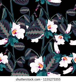 Seamless pattern with tropical  leaves and exotic plants. Dark blue palm leaves and hibiscus flowers on the black background. Vector seamless pattern. Tropical illustration. Jungle foliage.