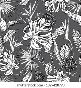 Seamless pattern with tropical leaves and exotic flowers. Black and white hand drawn vector.