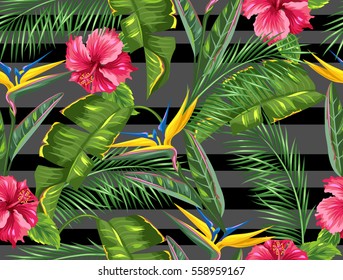 Seamless pattern with tropical leaves and flowers. Palms branches, bird of paradise flower, hibiscus.