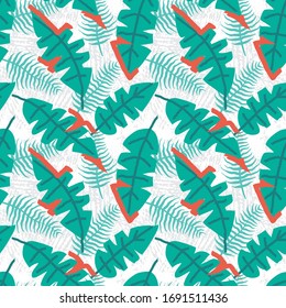 Seamless pattern of a tropical leaves with green and orange background elements.