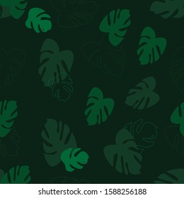 Seamless pattern. Tropical leaves and leaf outline on a green background. Vector. Suitable for fabric, cover design, wrapping paper