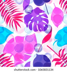 Seamless pattern of tropical leaves on the watercolor dotted background. Bright Summer floral fabric design. Vector illustration EPS 10 file.