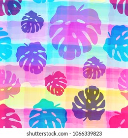 Seamless pattern of tropical leaves on the watercolor stripped background. Bright Summer floral fabric design. Vector illustration EPS 10 file.
