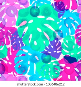 Seamless pattern of tropical leaves on the watercolor dotted background. Bright Summer floral fabric design. Vector illustration EPS 10 file.