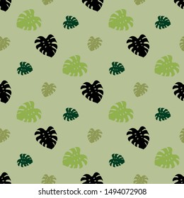 Seamless pattern with tropical leaves on light green background for plaid, fabric, textile, clothes, tablecloth and other things. Vector image. 