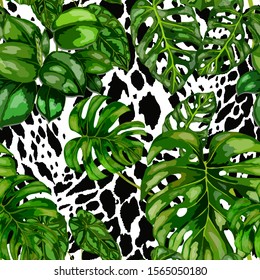 Seamless pattern with tropical leaves on cheetah spots. Beautiful allover print with hand drawn exotic plants. Summer nature jungle print. Can be used for any kind of a surface design. Vector.