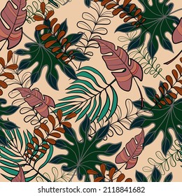 Seamless pattern with tropical leaves on a beige background