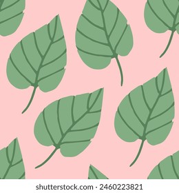Seamless pattern of tropical leaves on a pink background.Summer vector background of jungle leaves.