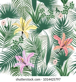 Seamless pattern of tropical leaves of palm tree and flowers. Vector background.