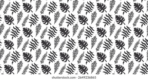 Seamless pattern of tropical leaves silhouettes