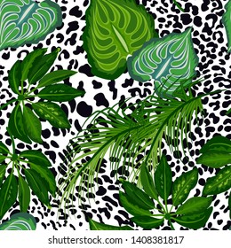 Seamless pattern of tropical leaves and spotted panthers, jaguars.