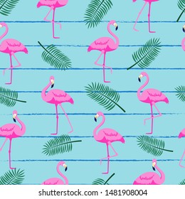 Seamless pattern with tropical palm leaves and flamingo. Blue striped background. Vector illustration. 