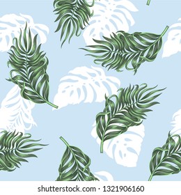 Seamless pattern with tropical palm and monstera leaves for fabric design 