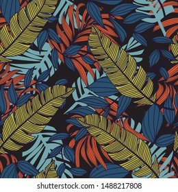 Seamless pattern in tropical style in blue tones. Exotic Wallpaper, palm leaves. Botanical pattern. Floral design. Summer concept with tropical leaves and plants. Modern design, printing, fabric