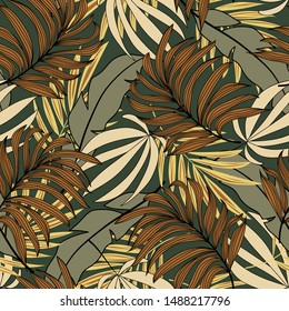 Seamless pattern in tropical style with plants and leaves in Safari colors. Modern design, printing, fabric, textile. Botanical pattern. Exotic Wallpaper, palm leaves. Jungle print.