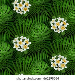 Seamless pattern of tropical white flowers and green leaves isolated on black. Floral tropical wallpaper, textile print, exotic background.