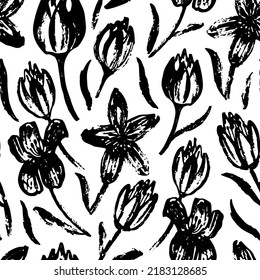 Seamless pattern with tulips.  Modern monochrome background. Black and white ink brush texture. Floral vintage seamless pattern. Isolated vector illustration.