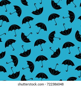 Seamless pattern with umbrella on blue background. Hand drawn