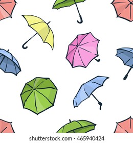 Seamless pattern with umbrellas. Cute colorful autumn background. Different hand drawn umbrellas. 