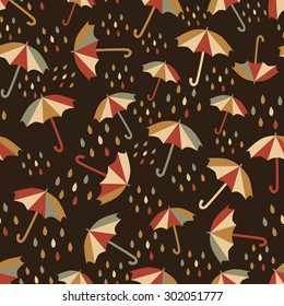 Seamless pattern with umbrellas and rain drops.