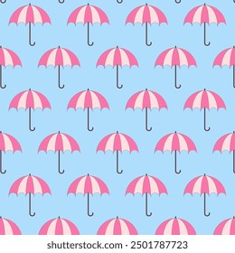 Seamless pattern with umbrellas.Pink umbrella repeat pattern isolated on blue background.Vector graphic background.