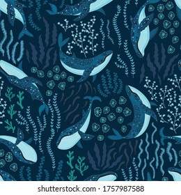 Seamless pattern with underwater humpback whales dancing under the sea on dark blue background. Vector illustration with whales in riverbed surrounded by seaweed and algae.