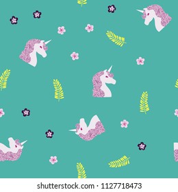 Seamless pattern with a unicorn, tropical flowers and leaves on a blue background. Unicorn with brilliance.