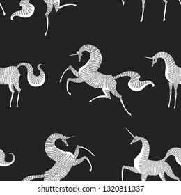 Seamless pattern. Unicorns on a black background.