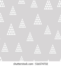 Seamless pattern. Unusual geometric christmas trees on gray background. Wrapping paper.