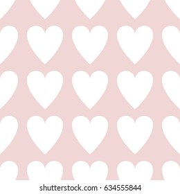 Seamless pattern Valentine's Day with a big white hearts on a light pink pale dogwood background.
