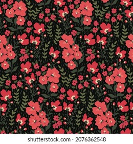 Seamless pattern with variegated floral meadow. Vintage print with small pink flowers, leaves on a dark background. Vector illustration.