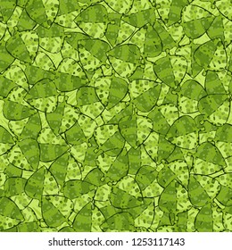 Seamless pattern of variegated green maple leaves lying on a background of square weaving. Camouflage.