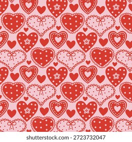 Patrón sin fisuras con varios corazones decorativos en rojo y rosa. Diseño romántico juguetón para papel de regalo de San Valentín, textiles, papelería y proyectos temáticos de amor.