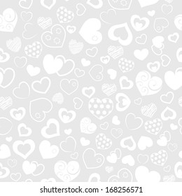 Seamless pattern of various hearts, white on gray
