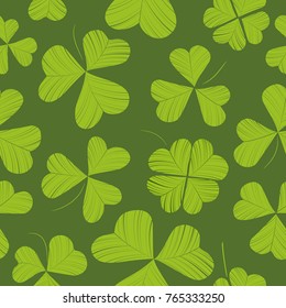 Seamless pattern with various shamrock leaves on green background