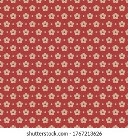 Seamless pattern vector design of small flowers on red background. The cute template for fashion prints, wallpaper, textile, and wrapping paper.