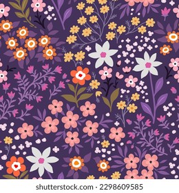 Seamless pattern. Vector flower design with cute wildflowers. Romantic abstract floral pattern on purple background. Illustrations of spring nature with pink, orange, white and purple flowers.