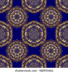 Seamless pattern of vector golden elements on a blue background.