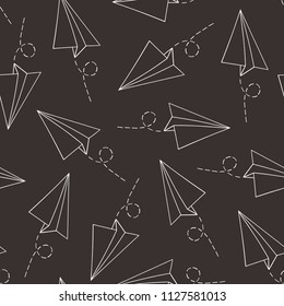 Seamless pattern with vector paper airplane over black. Travel, route symbol