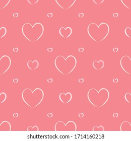 Seamless pattern vector with shades of soft pink hearts with paintbrush stroke effect doodle drawings. Illustration is isolated on salmon color background. Great for textiles and wrapping paper.