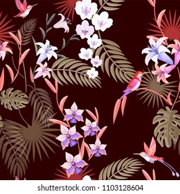 Seamless pattern. Vector summer background.  Hummingbirds and flowers and palm leaves textile print. 