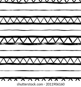 Seamless pattern with vector triangles and lines. Hand drawn aztec geometric background. Tribal and ethnic abstract wallpaper. Zig zag black paint lines in grunge style. Rubber dry brush texture.