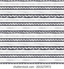 Seamless pattern with vector triangles and lines. Hand drawn aztec geometric background. Tribal and ethnic abstract wallpaper. Zig zag black paint lines in grunge style. Rubber dry brush texture.