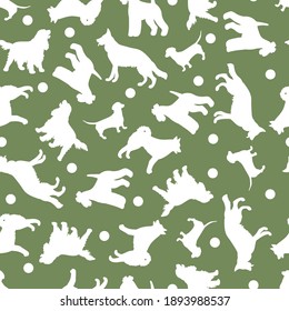 Seamless pattern with vector white silhouettes of different dog breeds on a green background. For the design of packages, covers, textile prints