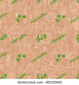 Seamless pattern with vegetables on beige background. Vector illustration for your design