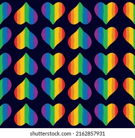 Seamless pattern of vertical striped rainbow hearts on a square dark blue background. Hearts made with colored paint. Vector illustration.