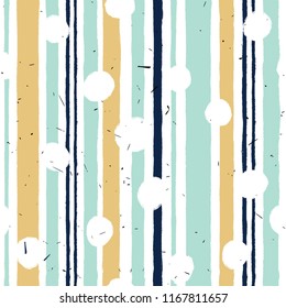 A seamless pattern with vertical stripes in pastel colors: mint, gold, dark blue.
