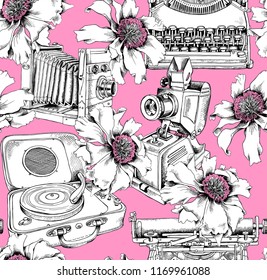 Seamless pattern with a Vintage Camera, Typewriter, Gramophone, Slide projector and peony flowers on a pink background. Wallpaper, Textil, hand drawn style print. Vector illustration.