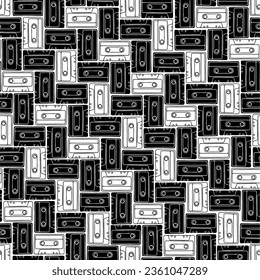 Seamless pattern with vintage cassette tapes in black and white. Vector illustration.